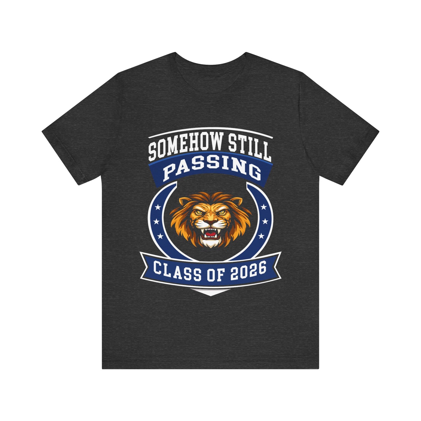 Somehow Still Passing — Funny Senior Lion Tee (Class of 2026)