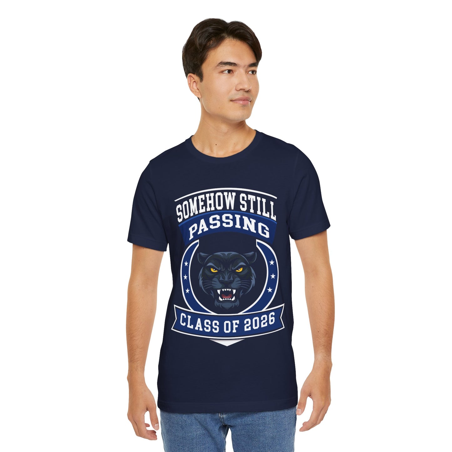 Somehow Still Passing — Funny Senior Panther Tee (Class of 2026)